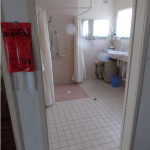 looking into bathroom with shower and basin