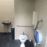 berry-showground accessible toilet with rear and side rails