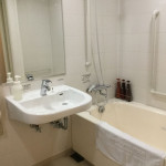 view of basin and shower/bath